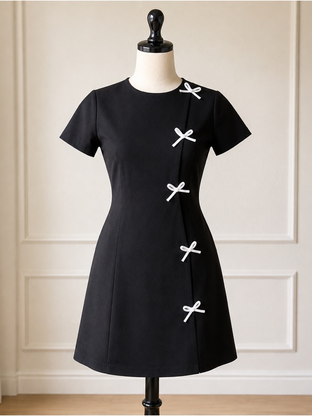 Classic Black Fit-and-Flare Dress with White Bow Accents